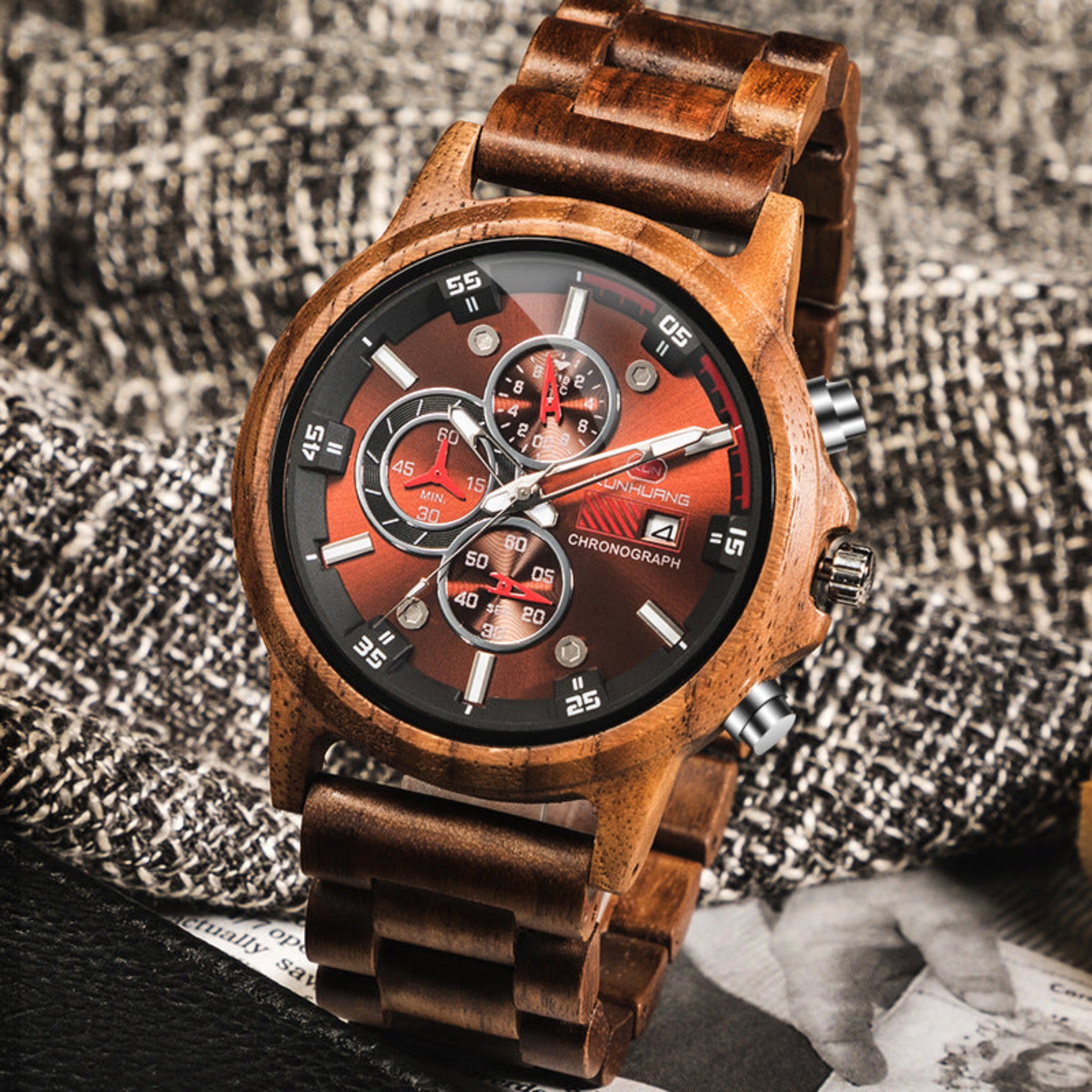 Wooden wristwatch with a detailed face on a textured fabric background