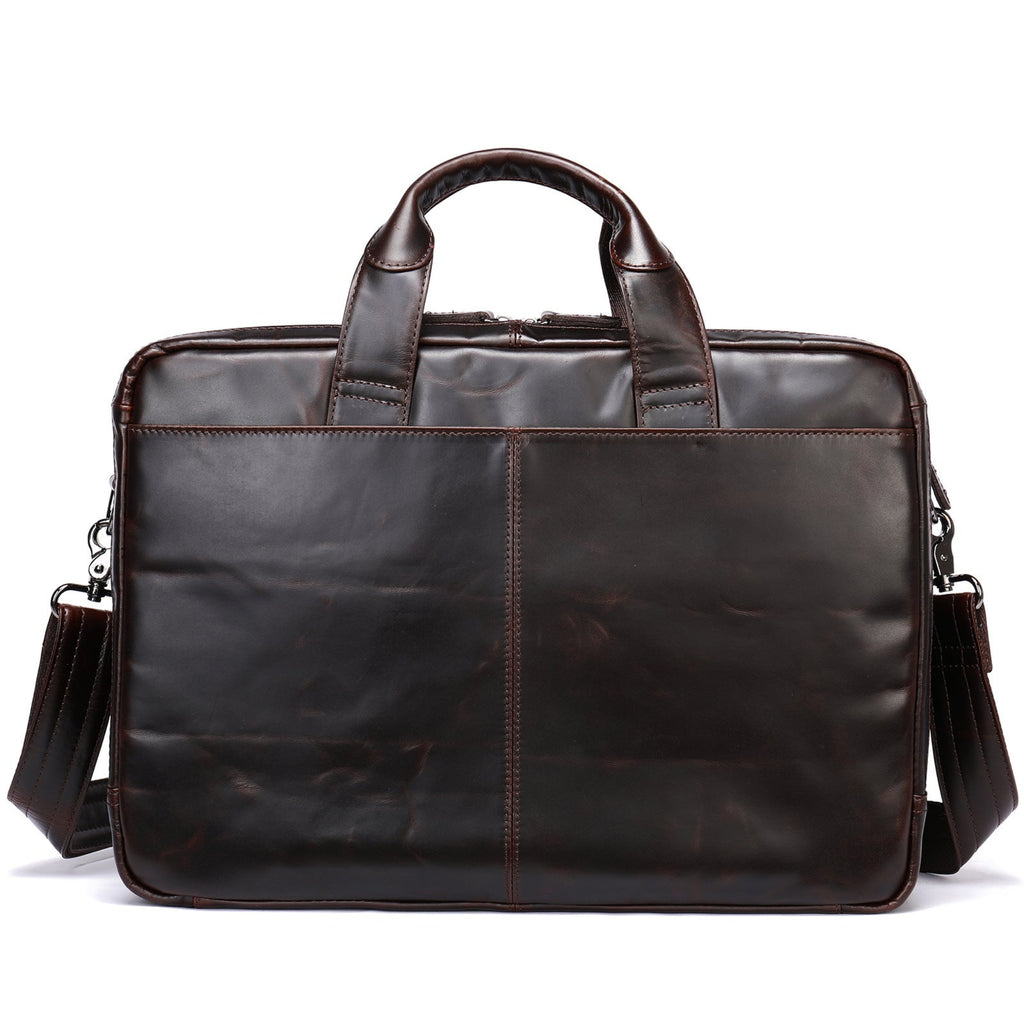 Brown leather briefcase with shoulder strap on a white background