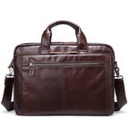 Brown leather briefcase with shoulder strap on a white background