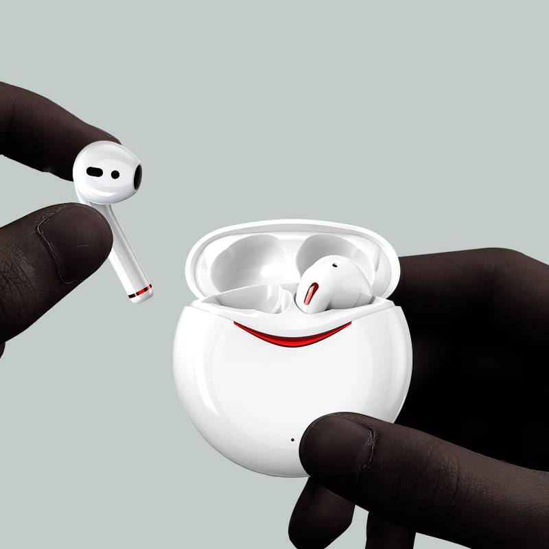 XT17 Bluetooth earbuds in white with red accents being removed from case