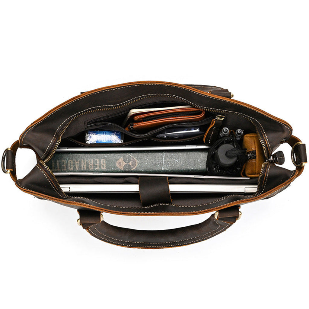 Brown leather bag with compartments on a white background