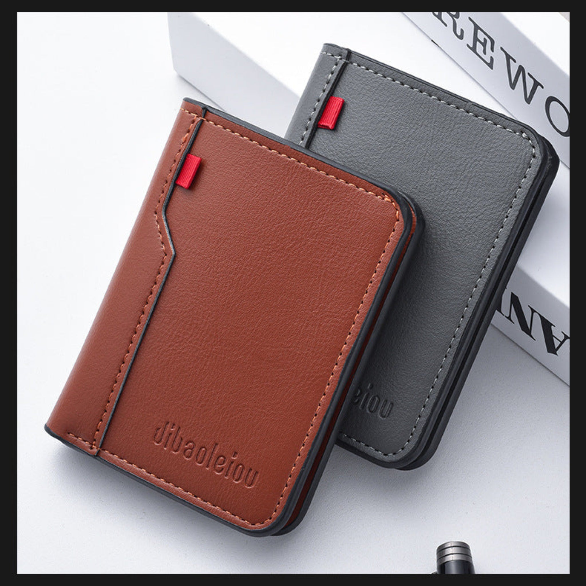 Brown and gray leather card holders with visible brand name on a white background